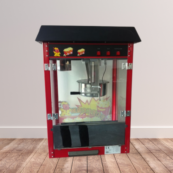 Machine à pop-corn de dos sur un fond de plancher