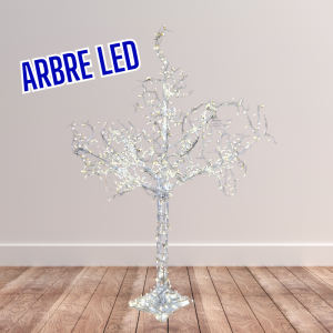 un arbre blanc factice avec des lumières led sur un fond de plancher et mur blanc